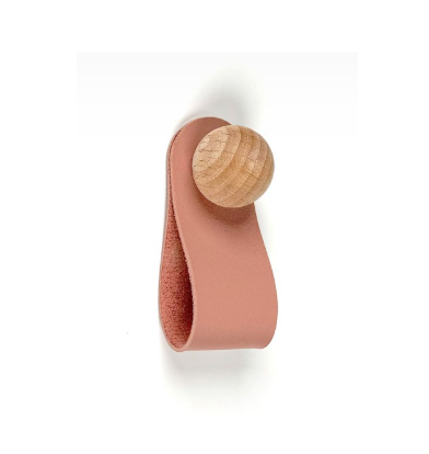 Handcrafted pink leather loop handle with natural wood knob, designed for kids' rooms and custom interior projects with delivery across Europe.
